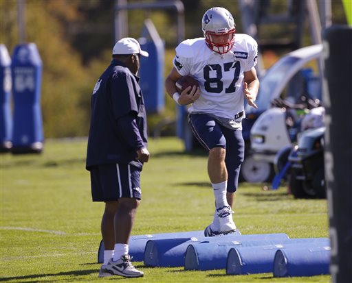New England Patriots running backs coach Ivan Fears watches as tight end Rob Gronkowski (87) runs a drill before practice Wednesday at the team's facility in Foxborough, Mass., Wednesday.