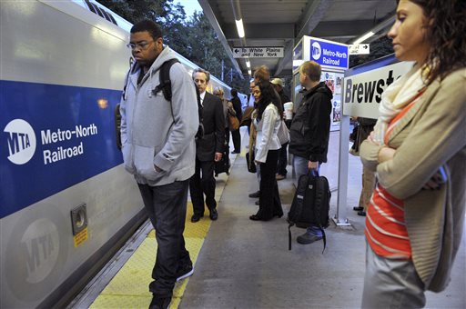 Commuters wait Thursday at the Brewster, N.Y., station for the 6:44 a.m. train to Grand Central Station in New York. A power failure on the rail line in the Stamford, Conn., area Wednesday disrupted travel for tens of thousands of commuters heading into the city.