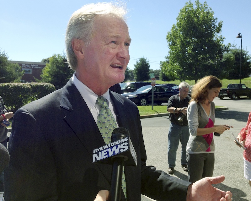 Rhode Island Gov. Lincoln Chafee speaks to media outside a department of motor vehicles office Wednesday, Sept. 4, 2013, in Cranston, R.I. Chafee said he is not running for a second term, bowing out of what was expected to be a fierce primary in his new Democratic Party. (AP Photo/Michelle R. Smith)
