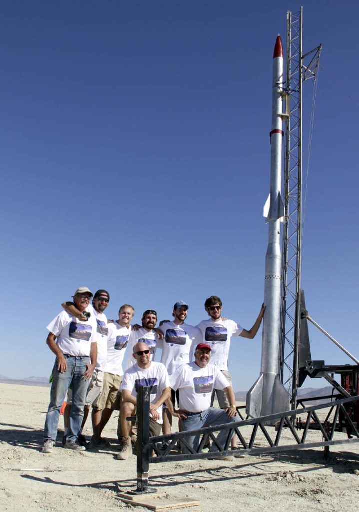 The team and rocket designed, built and launched by former and current University of Maine students, including Winslow's Michael Ostremecky, are pictured in Nevada prior to the rocket's launch on Monday. Standing, left to right, are Dick Matthews, Fritz Sexton, Gerard Desjardins, Ostremecky, Josh Mueller and Luke Saindon. Kneeling are Charles Kennedy, left, and Thomas M. Atchison.