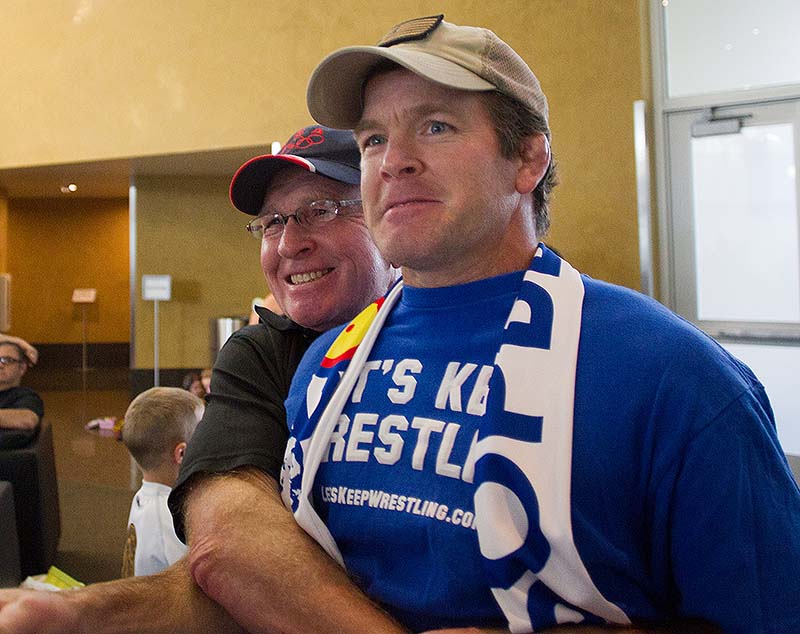 Wrestling legend Dan Gable celebrates with Iowa associate head coach Terry Brands after the International Olympic Committee voted, in a meeting in Buenos Aires, Argentina, to reinstate wrestling for the 2020 Olympics on Sunday.
