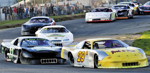 THEY’RE OFF: Ricky Morse (29) edges Josh St. Clair, left, at the start of the Last Chance Motorsports 150 race late Sunday at Unity Raceway.