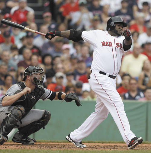 BIG HITTER: Boston’s David Ortiz, right, hits an RBI double off a pitch by Chicago White Sox pitcher Andre Rienzo as catcher Tyler Flowers looks on in the second inning Sunday at Fenway Park, in Boston.