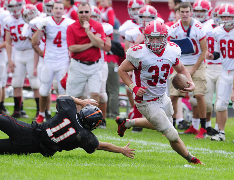 JUST OUT OF REACH: Brewer defensive back Dan Davis dives and misses Cony’s Reid Shostak during a game Saturday at Alumni Field in Augusta.
