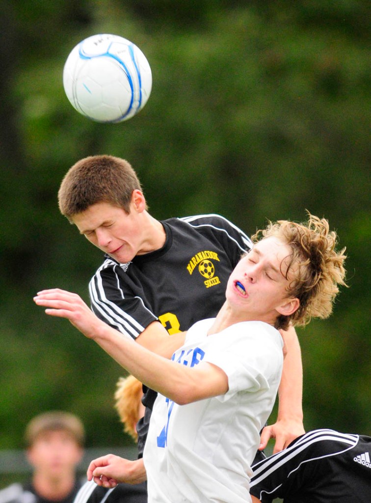 SMASH: Maranacook’s Kent Mohlar, left, and Erskine’s Phoenix Throckmorton go up for a header during a game Tuesday at Erskine Academy in South China.