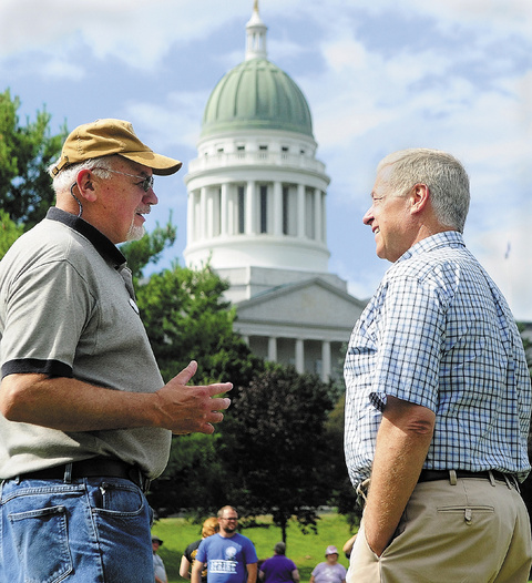 Charlie Conley, left, of Waterville, chats with Congressman Mike Michaud during the annual Central Maine Labor Council Annual Labor Day Picnic on Sunday at Capitol Park in Augusta.