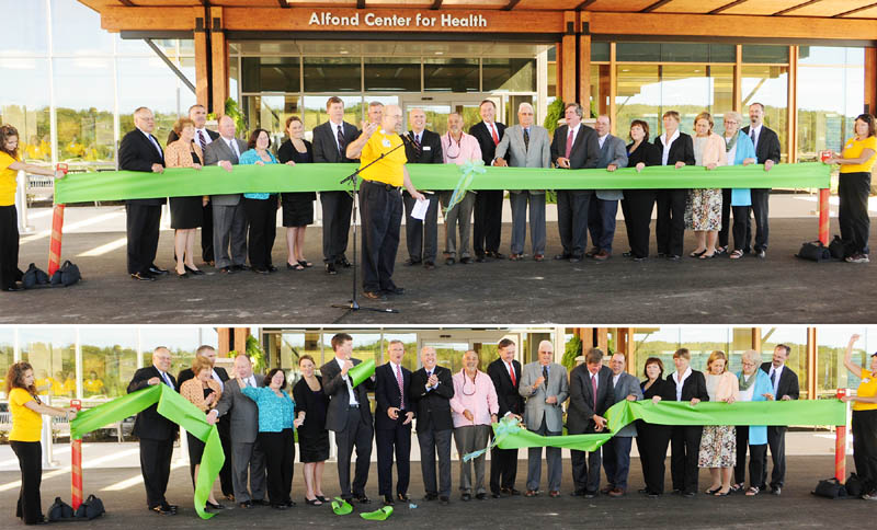 The Rev. David Gant, director of spiritual care, center, says a prayer before a ceremonial ribbon-cutting at MaineGeneral Medical Center's new Alfond Center for Health today in Augusta.