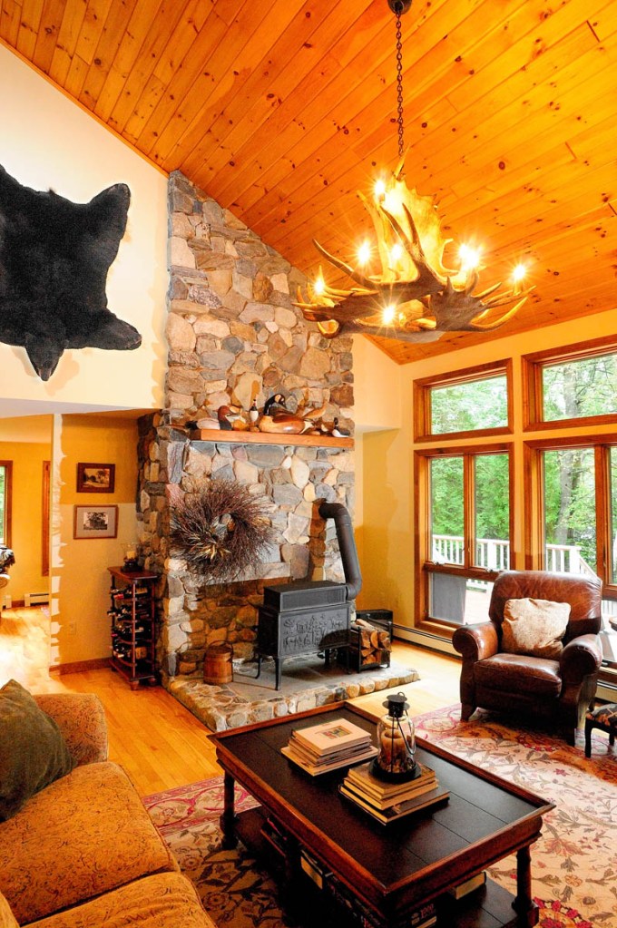 This is the living room, which features a moose antler chandelier and a hanging bear skin at the home of Bruce and Susan Burleigh as seen on Tuesday during a preview for the Homes of Wayne tour that will be held this Saturday. The event is a fundraiser for the Wayne Community Church and the Cary Memorial Library. Tickets are available at the library.