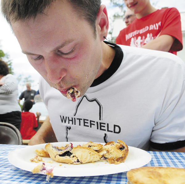 Tyler Pope, 32 of Whitefield, won the pie-eating contest during Whitefield Community Day today in Whitefield. Pope was the fastest of four contestants to eat three Table Talk pies without using his hands. His prize was a full-sized pie from The Chase Farm Bakery.
