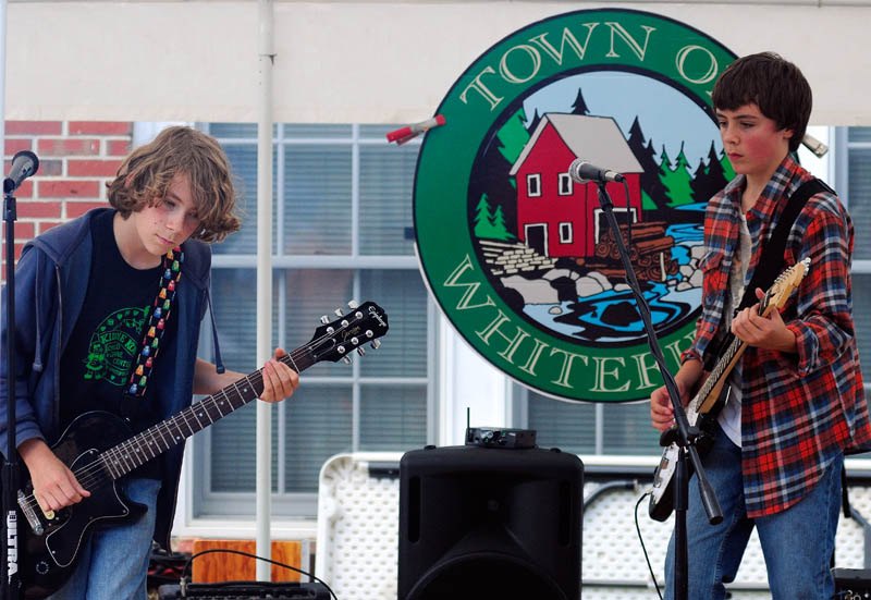 Milo Lani-Caputo, left, and Connor McLean, billed as Double Jinx, perform during Whitefield Community Day today in Whitefield.