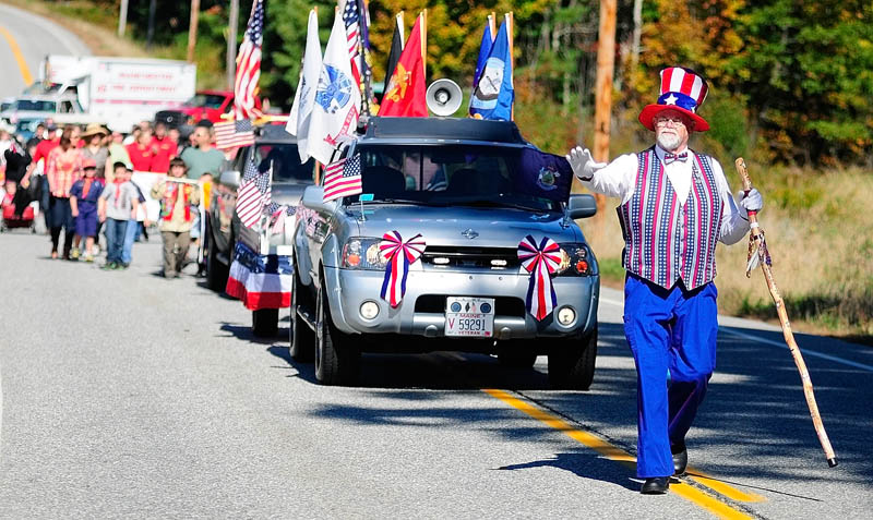 Willie Danforth, from the Franco-American War Veterans Post 31 in Lewiston and dressed as Uncle Sam, leads the 10th annual Manchester Apple Festival parade on Saturday on Route 17 in Manchester. The parade route was about 1 1/2 miles long, starting at Worthing Road and going to the Town Office. Other events at the festival included a 5k road race, pie eating contest, live music and a fireworks show.