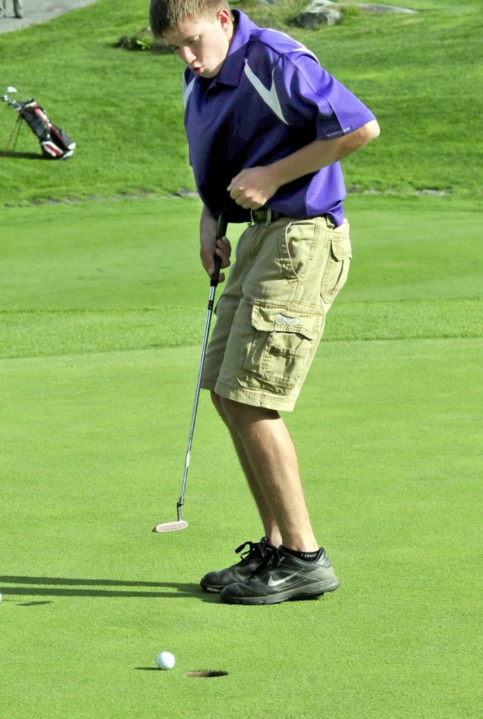 GET IN THE HOLE: Waterville’s C.J. Gaunce tries to coax his ball into the hole in a match against Messalonskee on Monday at Belgrade Lakes Golf Course in Belgrade. The shot came up just short. Gaunce finished with a 57.
