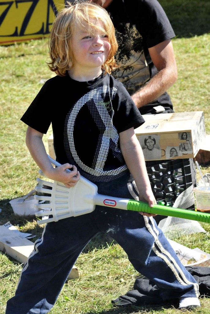 Aiden Henderson, of Portland, does an air rake as a band played during the Great North Fest in Norridgewock today.