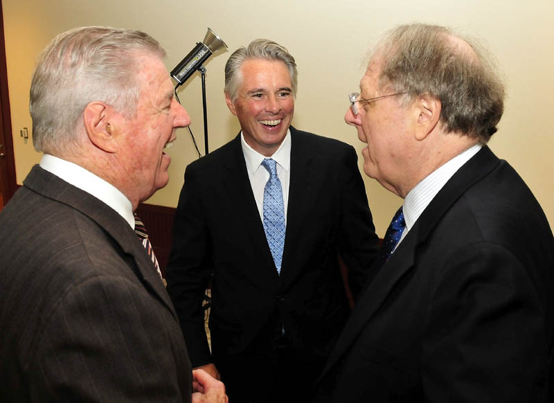 David A. Greene, center, has been named the next president of Colby College in Waterville. Greene is chatting with his father, Richard Greene, left, and Michael Gordon, chairman of Colby College's president search committee, during a reception today in Waterville.