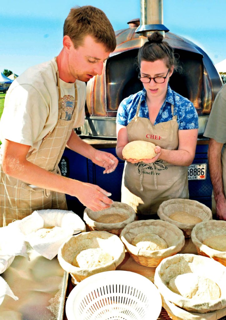 Jeff Dec and Lily Joslin sort bread dough Thursday that will help feed volunteers at the Common Ground Country Fair in Unity the next three days.