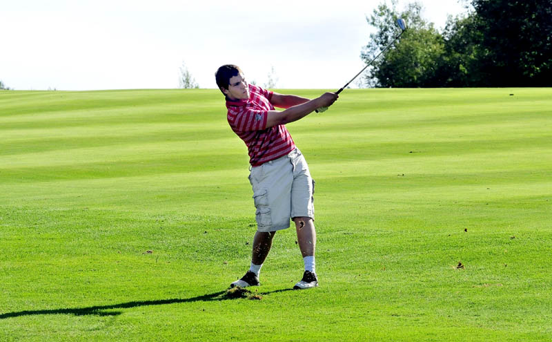 SWING AWAY: Messalonskee’s Kalib Bernatchez watches his drive in a match against Waterville on Monday at Belgrade Lakes Golf Course in Belgrade. Bernatchez shot a 46 on the par-35 course.