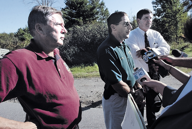 Police discuss details following the discovery of the body of Colby College student Dawn Rossignol along the Rice Rips Road in Oakland on Sept. 17, 2003. From left are then-Waterville Police Chief John Morris, Oakland Police Chief Mike Tracy and Maine State Police Detective Timothy Doyle.