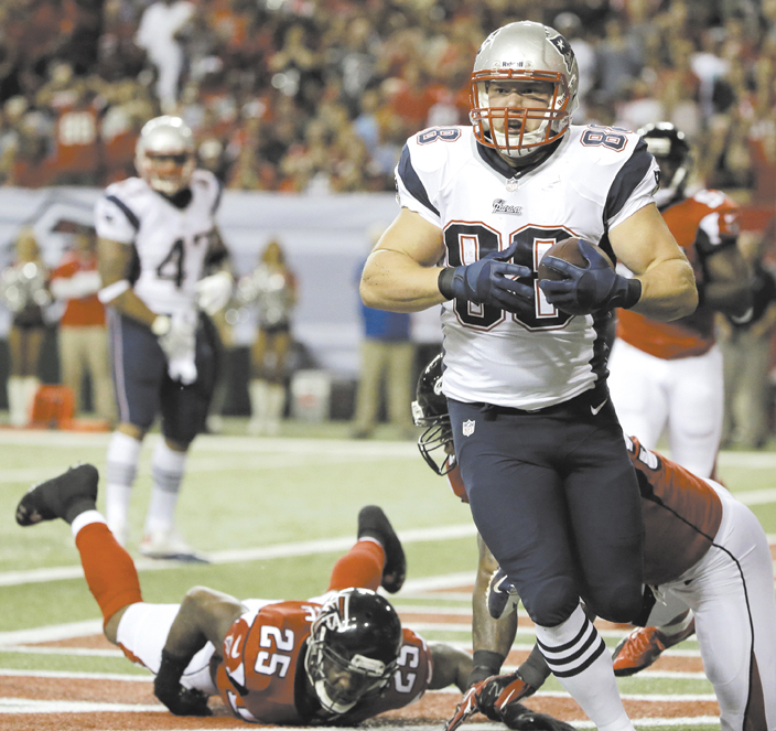 MAINE MAN: New England Patriots tight end Matthew Mulligan (88) catches touchdown pass against the Atlanta Falcons on Sunday in Atlanta. Mulligan, a West Enfield native, now has two touchdowns receptions in his NFL career. NFLACTION13; Georgia Dome