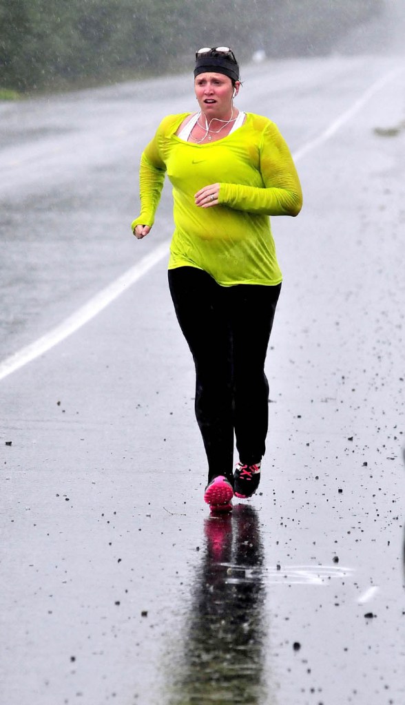 Jana White was soaked after running in a downpour through Norridgewock on a rainy Labor Day. Asked about the running conditions, White said, matter-of-factly, "It is what it is."