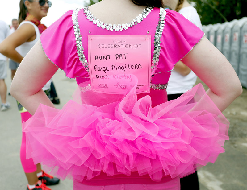 Fiona Markley of Falmouth is one of many to wear a pink outfit while participating in the Susan G. Komen Maine Race in Portland on Sunday.