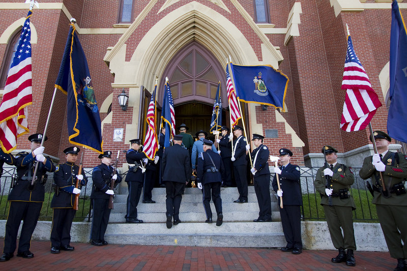 Public safety personnel enter the church for the Blue Mass, which takes place in Portland each year on the weekend closest to Sept. 11 to recognize the response to the 2001 terrorist attacks.