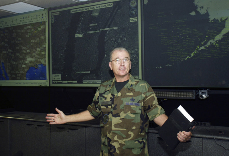 An officer at a Colorado fusion center, whose identity was withheld, gives the media a tour of the facility in 2004. Fusion centers were established to collect information on suspicious people and generate terrorism leads.