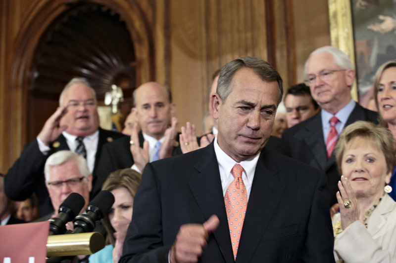 House Speaker John Boehner, R-Ohio, and Republican House members rally after passing a bill that would fund the government for three months while crippling Obamacare.