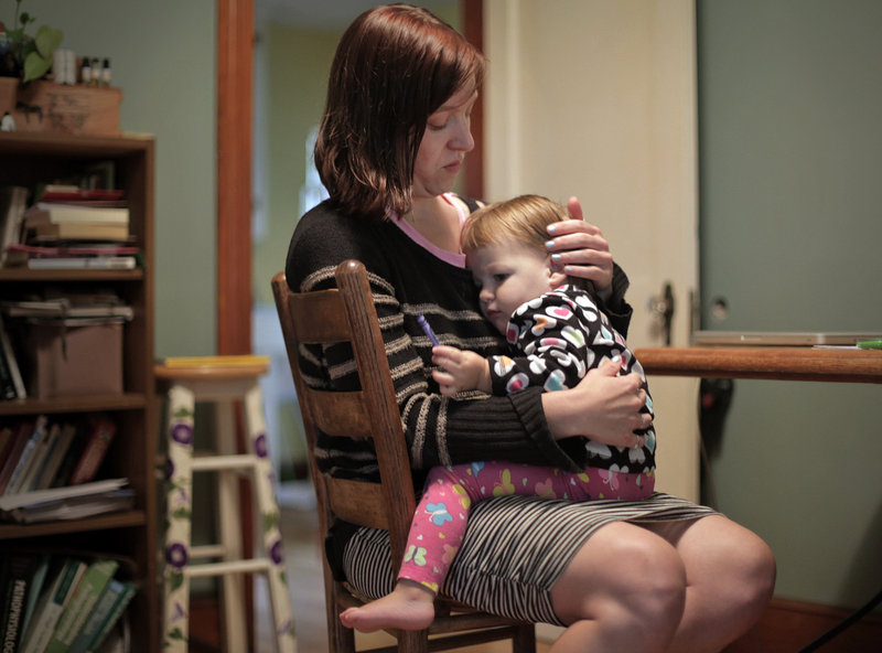 Erika Burkhart and her 18-month-old daughter, Lumi Stone, spend time together in their Portland home.