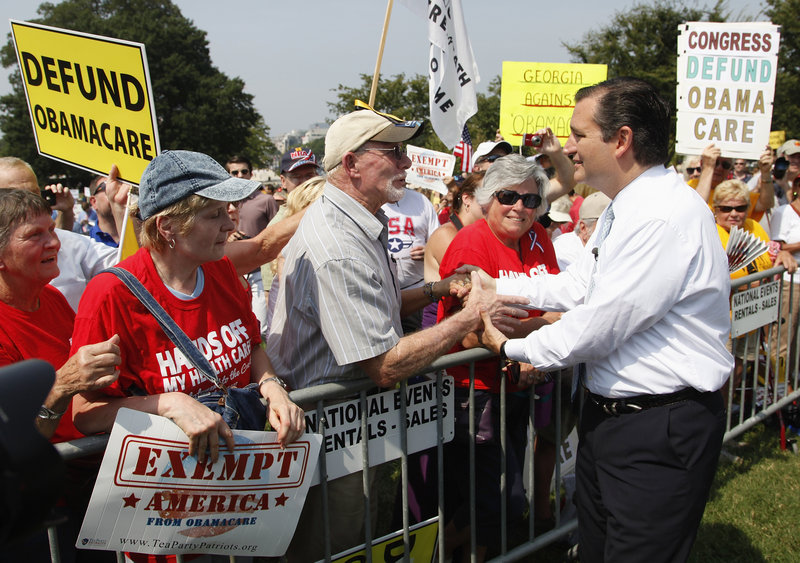 Sen. Ted Cruz greets attendees as he arrives to speak at the Exempt America from Obamacare rally on the west lawn of the U.S. Capitol in Washington on Sept. 10.