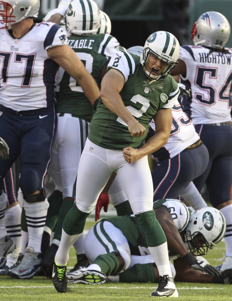 New York Jets kicker Nick Folk (2) reacts after kicking the winning 42-yard field goal in overtime. Folk’s missed 52-yard attempt was negated by an unusual New England penalty.