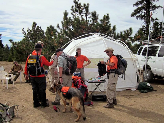 Volunteers and rescue workers gather before searching for missing hunter Gene Penaflor, who got hurt in a Northern California forest and was rescued Saturday after being lost for 19 days.