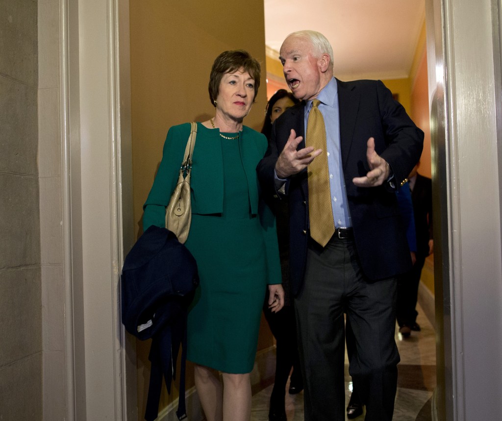 Sen. Susan Collins, R-Maine, talks with Sen. John McCain, R-Ariz., after arriving on Capitol Hill Friday following a meeting between Republican senators and President Obama at the White House. Collins has authored a 23-page proposal that would end the government shutdown and extend government funding for six months.
