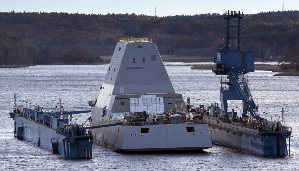 The first-in-class Zumwalt, the largest U.S. Navy destroyer ever built, floats off a submerged dry dock in the Kennebec River on Monday in Bath.