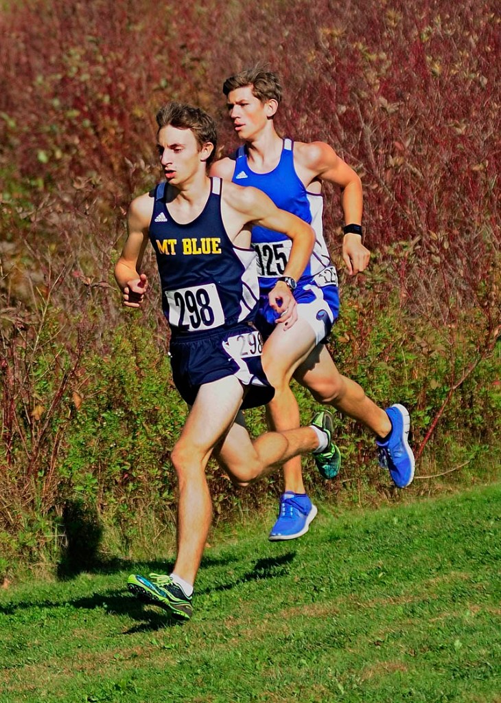 Mt. Blue's Josh Horne, left, and Erskine Academy's Erik Dodge were the early leaders at the KVAC cross country championships on Saturday October 19, 2013 at Cony High School in Augusta.