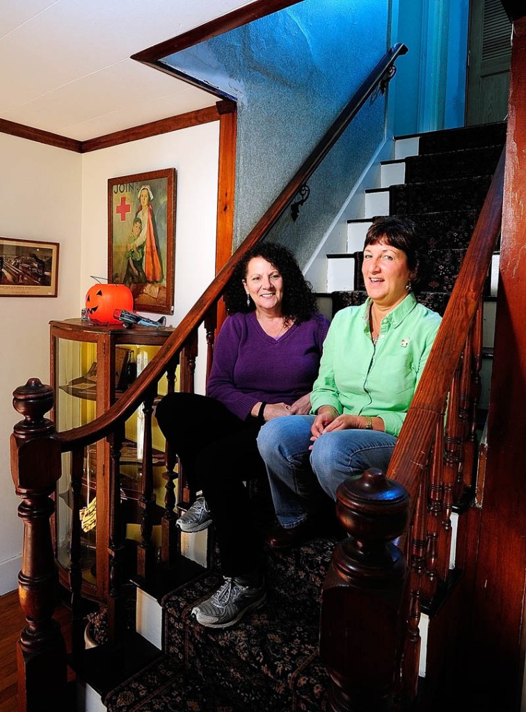 Annette Parlin, a medium/clairvoyant, left, and Cathy Cook, author of "Hauntings from Wayne and Beyond," talk about the book on Wednesday at Cook's home in Wayne.