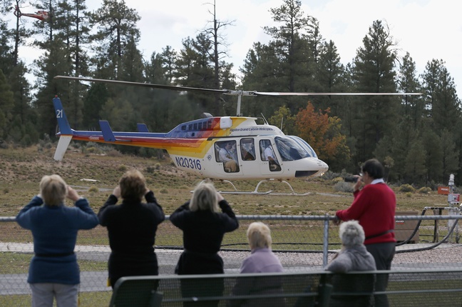 Hundreds of tourists flock to Grand Canyon Airport to take helicopter and plane tours as the only way they could see the Grand Canyon as the entrance to Grand Canyon National Park remains closed to visitors due to the continued federal government shutdown on Friday Oct. 11, 2013, in Tusayan, Ariz.