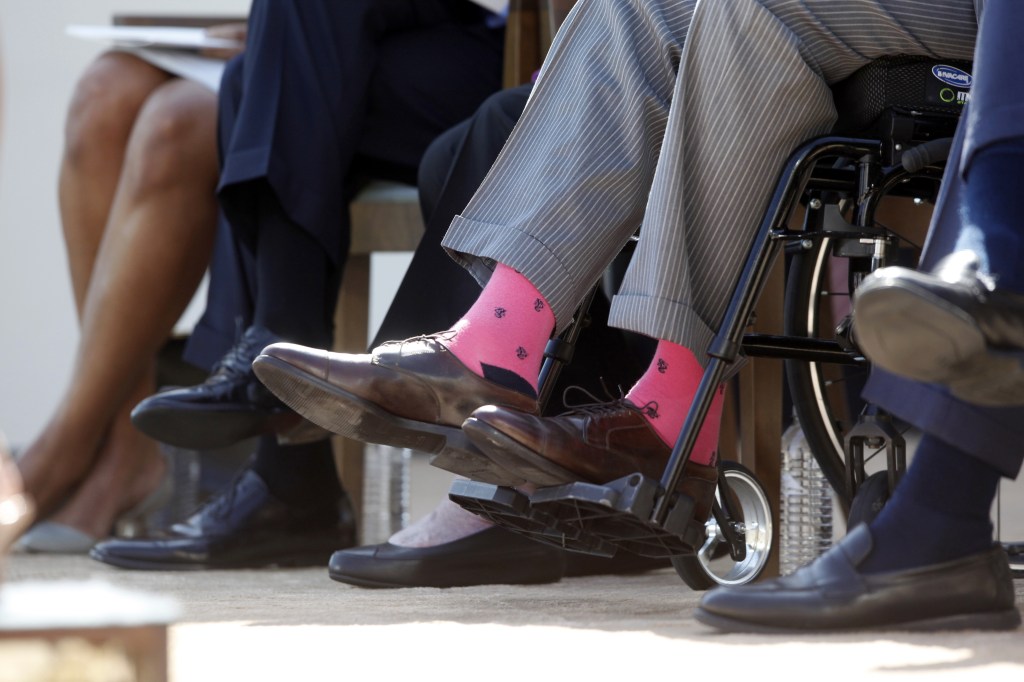 Former President George H.W. Bush wears a pair of his trademark wild socks at the dedication of the George W. Bush presidential library in Dallas in April 25. He’s donating a pair of socks to the Roman Catholic Diocese of Portland for a fundraising auction.