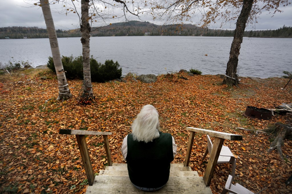 From the back steps of her father’s camp on Number Nine Lake in Township 9, Range 3, Diane Libby looks out over the landscape that she worries will be adversely affected by a $500 million wind turbine project – the largest in New England – proposed by EDP Renewables. At top, turbines populate the ridges of Mars Hill Mountain in eastern Aroostook County, where First Wind built a large-scale project in 2007.