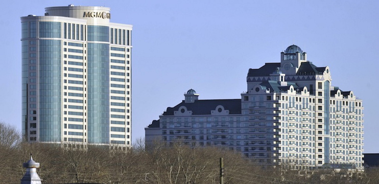 In this November 2010 file photo, the MGM grand tower at Foxwoods Resorts Casino rises over the landscape in Ledyard, Conn. MGM is ending its partnership with the casino as it focuses on its bid to build a casino in Springfield, Mass.