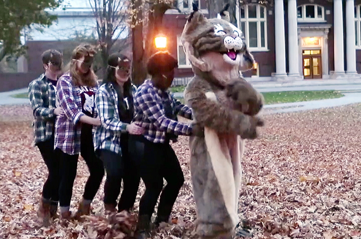 In this screen capture from a video produced by Bates College, members of the Bates Modern Dancers follow a bobcat, the school mascot, through the Lewiston campus. The school’s communications office says it made the video, “to showcase the fun spirit and talent” of Bates students. The video answers the question, “What does the bobcat say?”