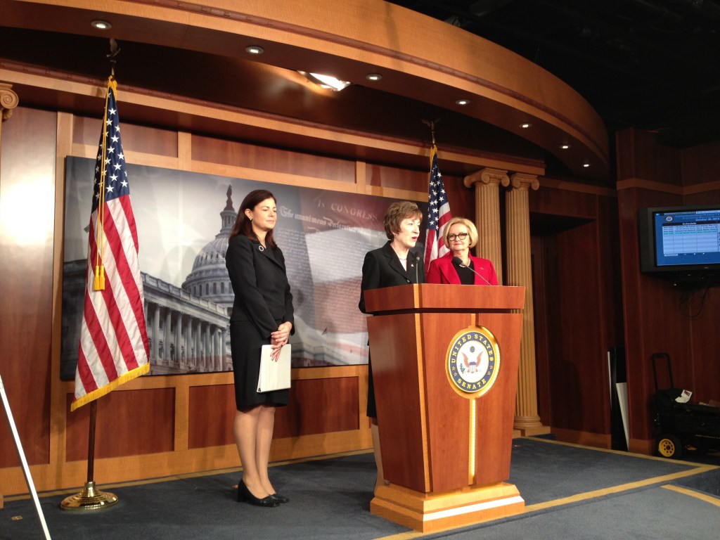 Republican Sens. Susan Collins of Maine, center, and Kelly Ayotte of New Hampshire, left, and Democratic Sen. Claire McCaskill of Missouri speak to reporters Wednesday about legislation they are co-sponsoring that would increase the frequency of background checks on individuals who already hold security clearances.