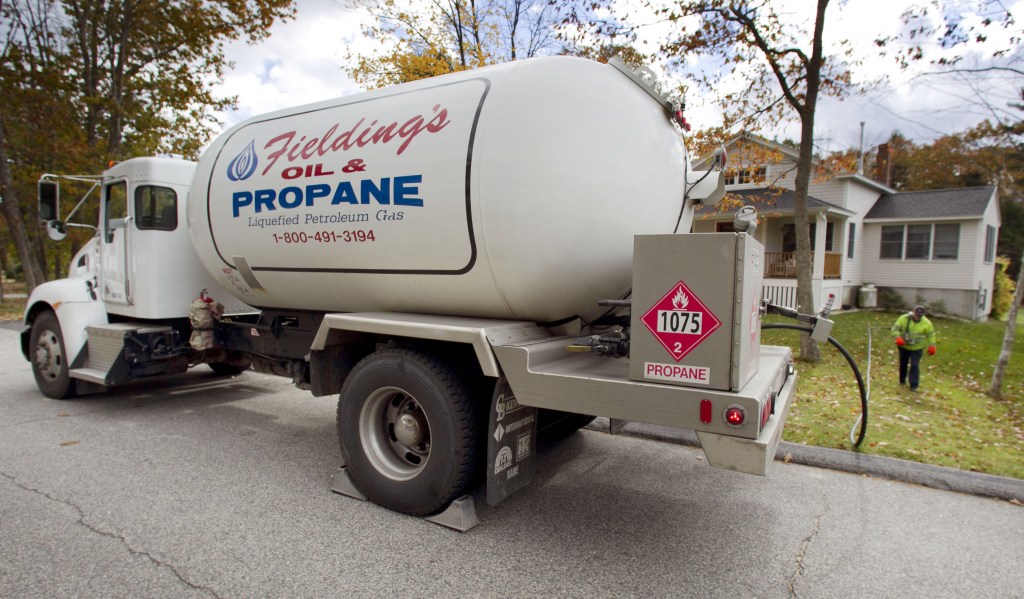 Propane is delivered to a home in Falmouth. As the leaves fall and the temperatures drop, a growing number of Mainers will be heating with propane. As U.S. propane production increases, prices are likely to come down.