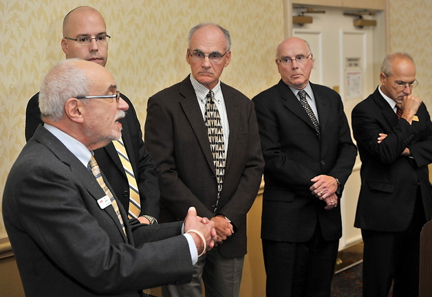Rich Livingston, left, AARP’s Maine volunteer state president, speaks as other association leaders look on, at a press conference held Saturday during the Maine Medical Association’s annual meeting in Portland.