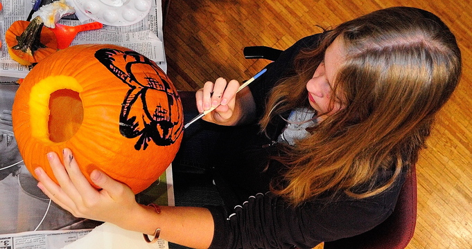 Spooky pumpkin: Kyara Dawbin paints a pumpkin during the After School Art Program on Wednesday at Johnson Hall in Gardiner.