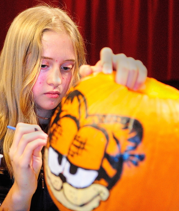 Pumpkin Painting: Kyara Dawbin paints a pumpkin during the After School Art Program on Wednesday at Johnson Hall in Gardiner.