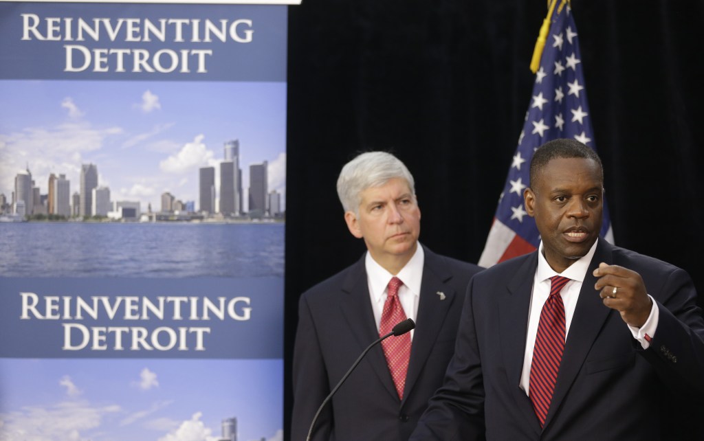 Kevyn Orr, right, state-appointed emergency manager for Detroit, and Michigan Gov. Rick Snyder hold a news conference about the city’s bankruptcy in Detroit in July.