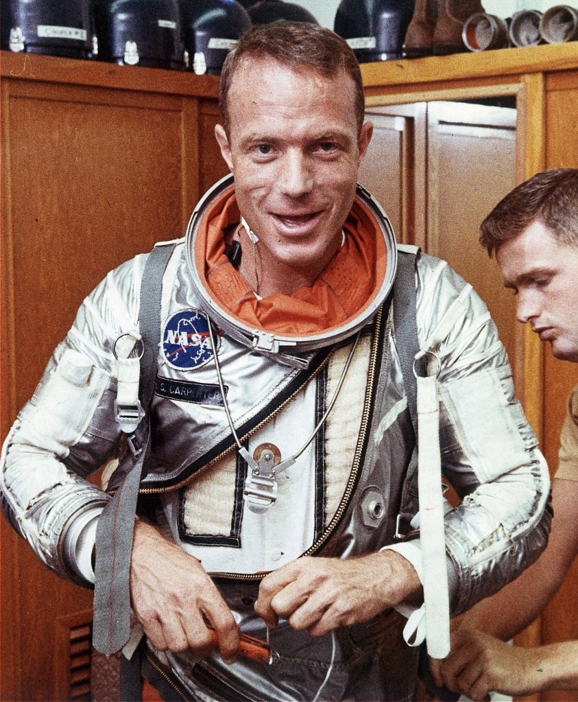 Astronaut Scott Carpenter has his space suit adjusted in Cape Canaveral, Fla. Carpenter, the second American to orbit the Earth and one of the last surviving original Mercury 7 astronauts, died Thursday.