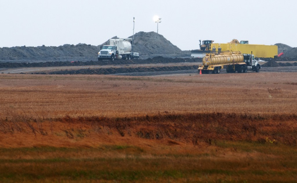 Cleanup continues at the site of an oil pipeline leak and spill north of Tioga, N.D., on Oct. 11.