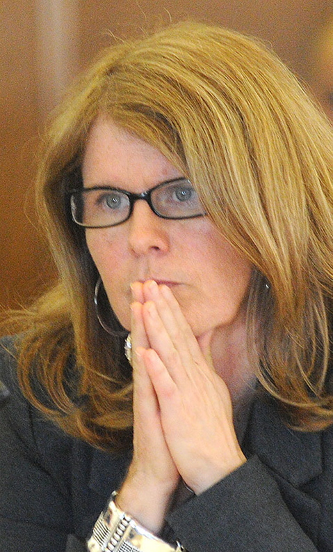 Health and Human Services Commissioner Mary Mayhew listens to a question from a legislator Wednesday during a joint hearing of the Health and Human Services and Appropriations committees at the State House in Augusta about the potential loss of $20 million in federal funding for the state’s Riverview Psychiatric Center. The federal Centers for Medicare and Medicaid Services made the decision to terminate Riverview’s funding after finding in two surveys that the hospital did not comply with federal guidelines for staffing and governance.