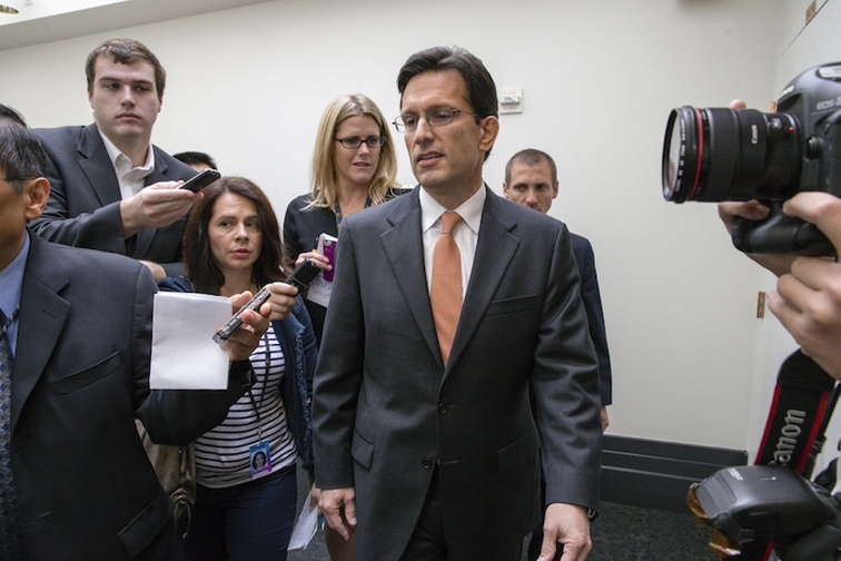 House Majority Leader Eric Cantor, R-Va., is pursued by reporters after a news conference about how the government shutdown is impacting on medical research, at the Capitol in Washington, Thursday, Oct. 3, 2013. A funding cutoff for much of the government began Tuesday as a Republican effort to kill or delay the nation’s health care law stalled action on a short-term, traditionally routine spending bill. Lawmakers in both parties have ominously suggested the partial shutdown might last for weeks.